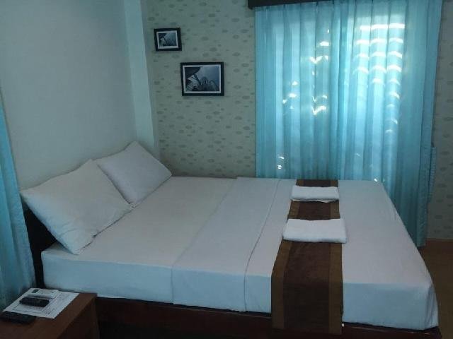 Double bed in a guest room at Asean Resort Ubon