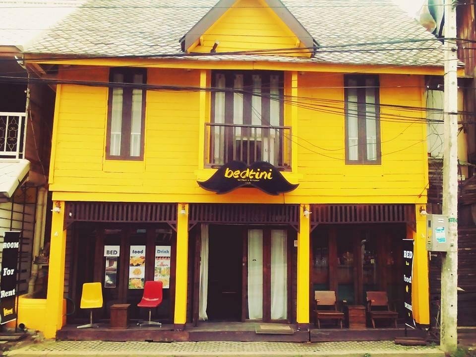 Yellow wooden facade of Bedtini Guesthouse