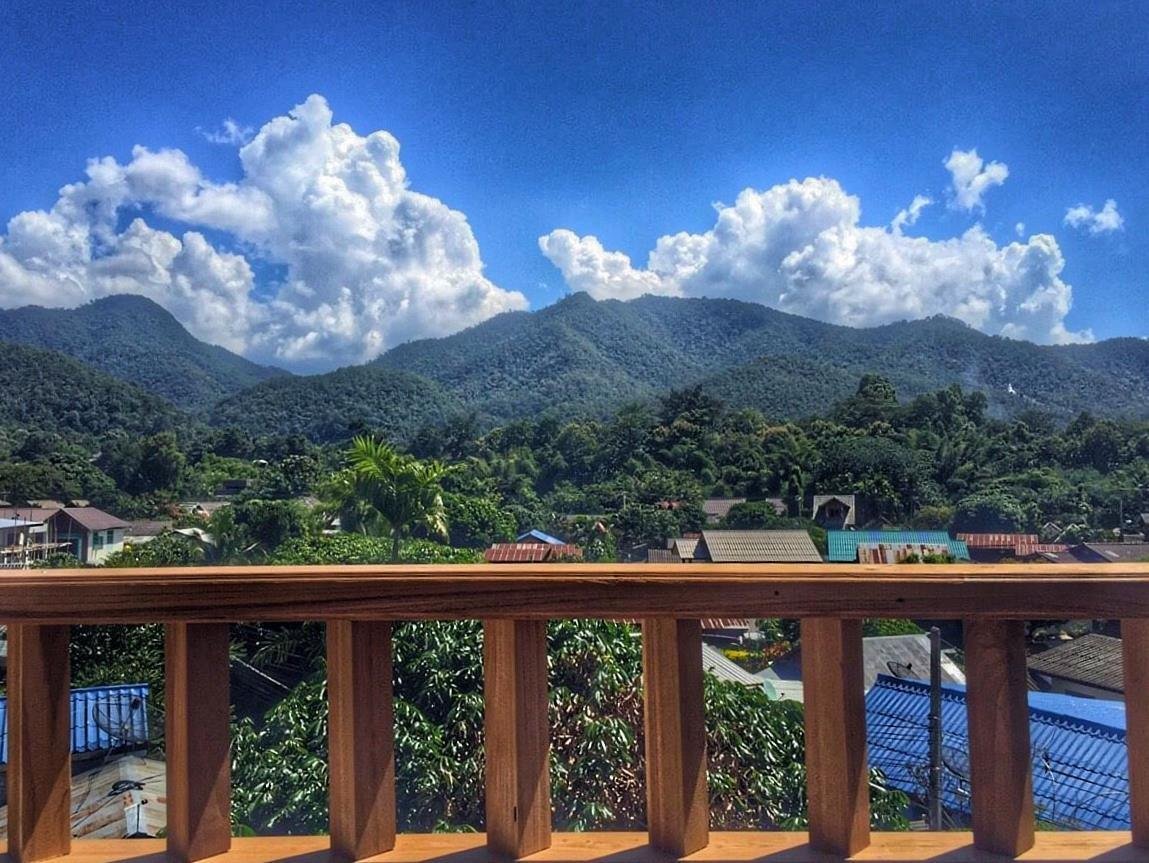 Mountain view from a wooden balcony at Pai Cherkaew