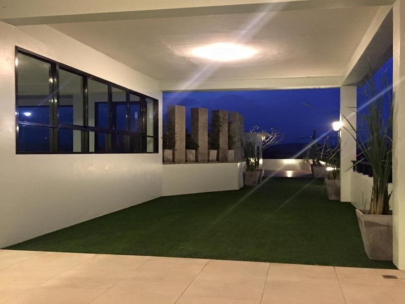 Covered open-sided area at Windee House in the evening